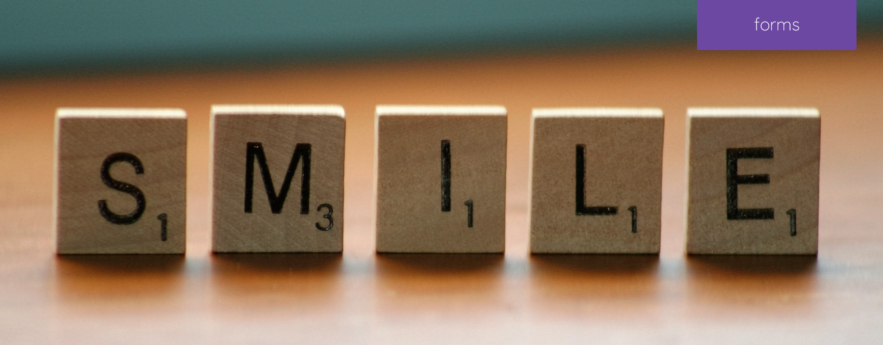 Block letters lined up that spell smile